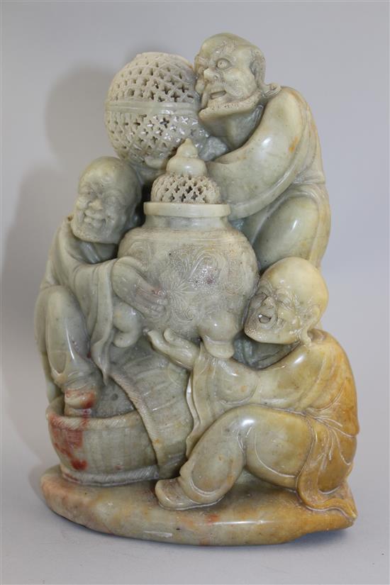 A Chinese soapstone group of three Luohan, 20th century, 22cm